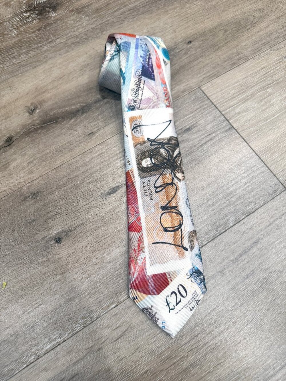 Vivienne Westwood silk tie featuring the iconic "Money" or "Currency" print.
